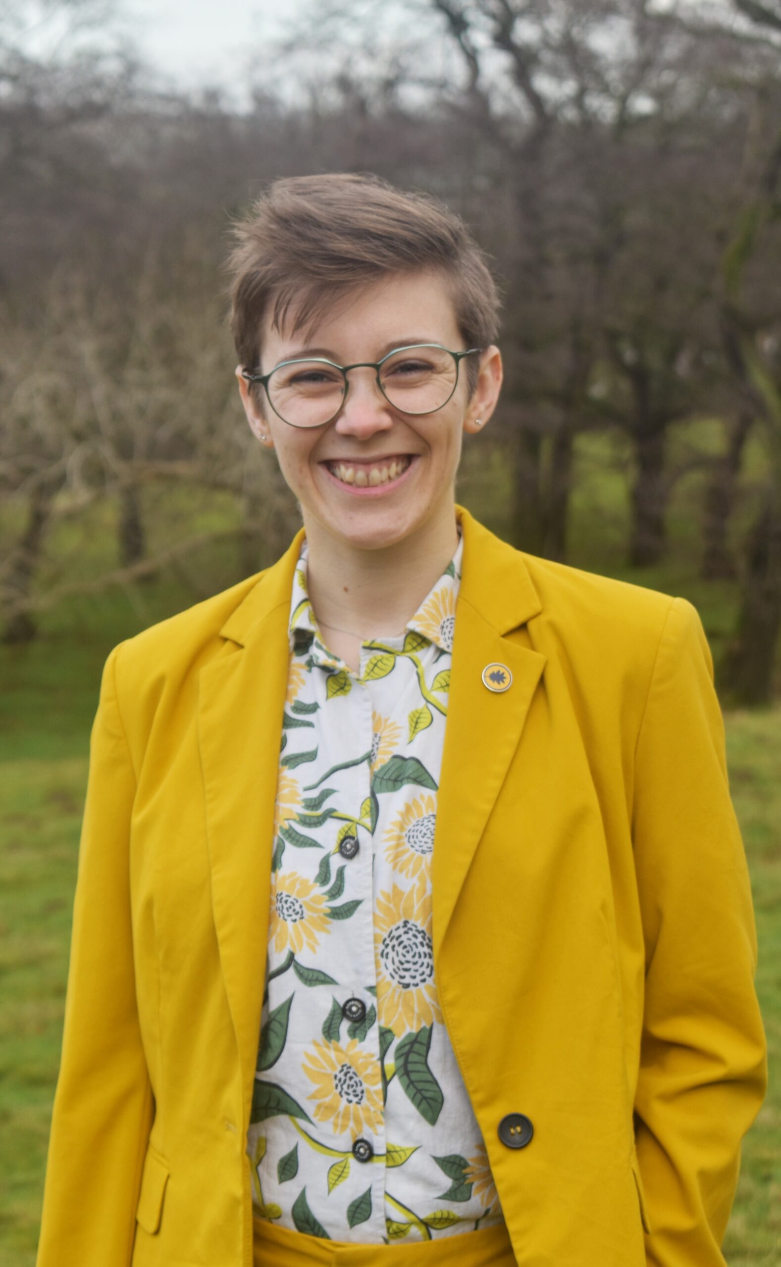 Photograph of Celebrant Tee in a yellow suit