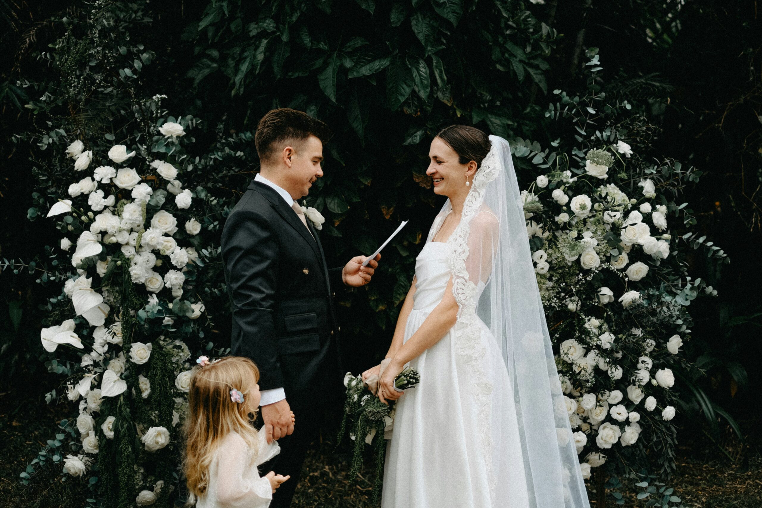 Couple Reading Wedding Vows with Child