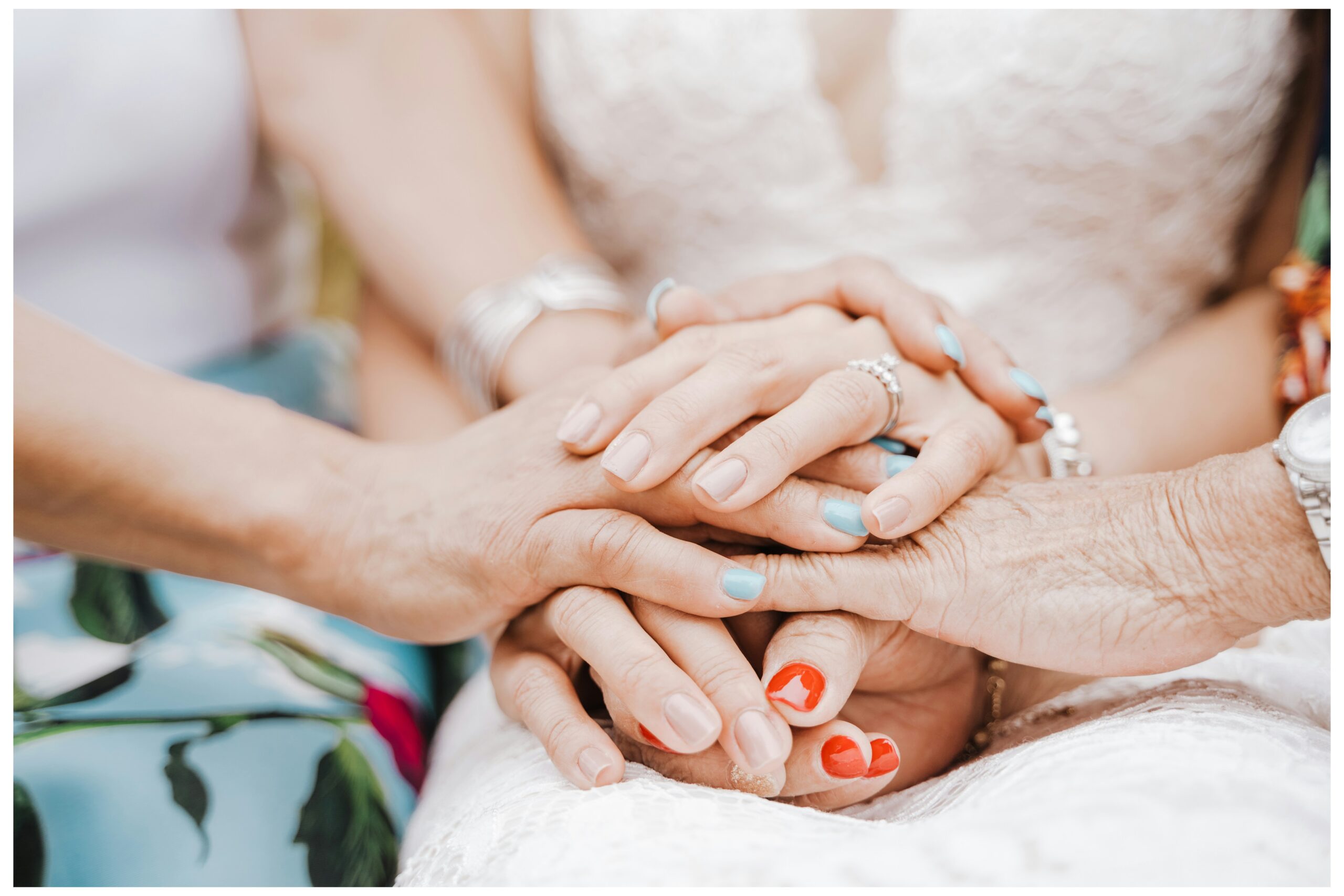Generations of hands on a wedding day